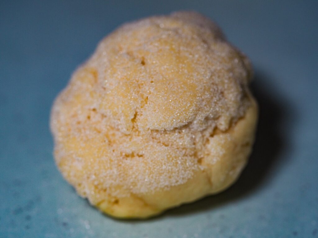 Lemon cookie dough rolled in granulated sugar